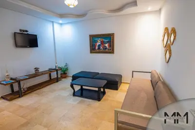 a living room with a couch and a table at MA Studio in Marrakech