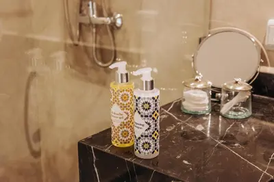 two bottles on a counter in a bathroom at Maison Dar Saada in Marrakech