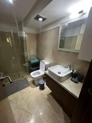 a bathroom with a toilet and a sink and a shower at Nouvel appartement de luxe Pearl garden in Marrakech
