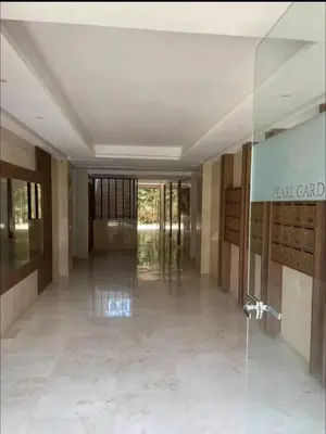 a hallway of a building with a glass door at Nouvel appartement de luxe Pearl garden in Marrakech