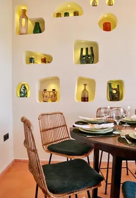 a dining room with a table and chairs at Domaine Homa Marrakech in Marrakech