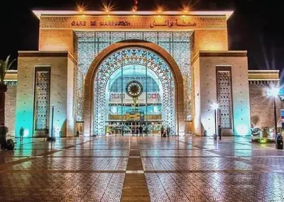 a large building with a lit up facade at night at Luxury city center apartment with swimming pool in Marrakech