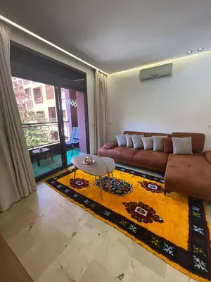 a living room with a couch and a table at Premium Hivernage Amazigh 2BR Flat - Zayane Homes in Marrakech