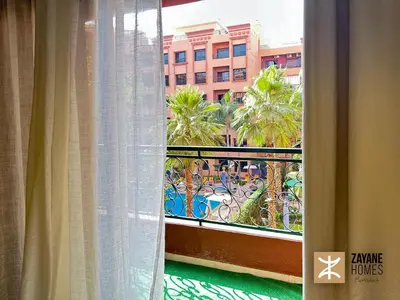 a window with a view of a building at Premium Hivernage Amazigh 2BR Flat - Zayane Homes in Marrakech