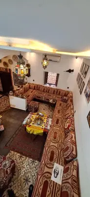 a living room with a couch and a table at Hostel Dar Ben Youssef in Marrakech