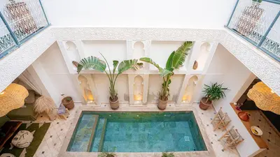 an overhead view of a swimming pool with potted plants at Riad Marssa, Privé Zen avec belle piscine dans la Médina in Marrakech