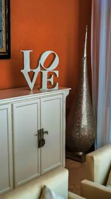 a living room with a white cabinet and a vase at Villa beldi chic Amelkis golf in Marrakech