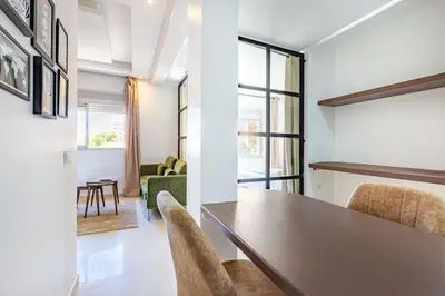 a dining room with a table and chairs in a room at New! Chic studio, centrale Guéliz Carré Éden in Marrakech