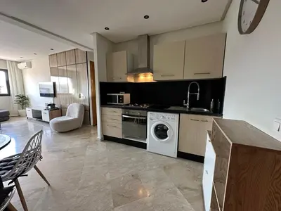 a kitchen with a washing machine and a stove at Appartement chic et cosy en plein centre de Gueliz in Marrakech