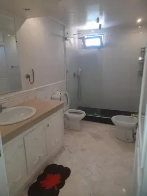 a bathroom with a sink and a toilet and a shower at App spacieux marrakech centre ville in Marrakech