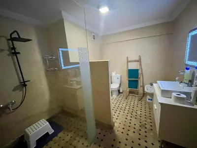 a bathroom with a shower and a sink and a toilet at Au Riad Des Sultans - Marrakech in Marrakech