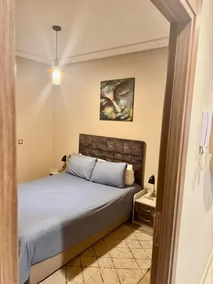 a bedroom with a bed in a room at Superbe appart au centre de gueliz in Marrakech
