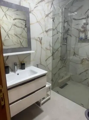 a bathroom with a sink and a shower at Charming Two-Bedroom Apartment in Marrakesh Gueliz in Marrakech