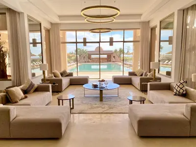 a large living room with couches and a pool at Luxury Villa Rêve D'ahlam à MARRAKECH in Oulad Boudene