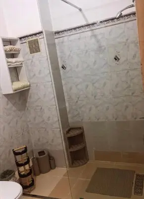 a bathroom with a shower with a glass door at appartement moderne,gueliz in Marrakech