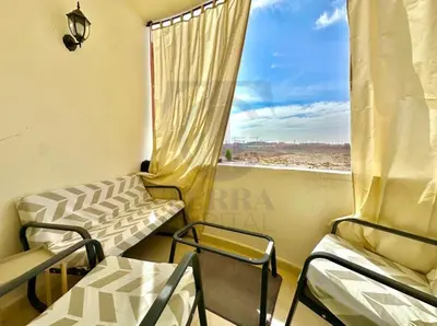 a room with chairs and a window with a view at appartement moderne,gueliz in Marrakech