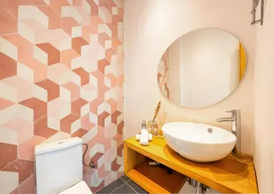 a bathroom with a sink and a mirror at le petit dar alwalidine in Marrakech