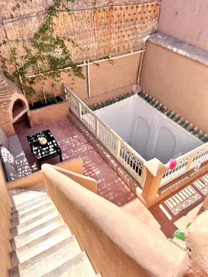 an overhead view of a small house with a balcony at Riad Ouatine in Marrakech