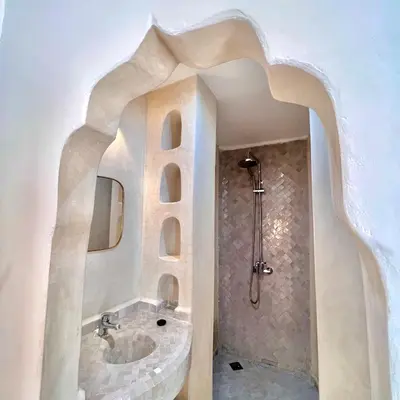 a bathroom with a sink and a mirror at Riad Ouatine in Marrakech