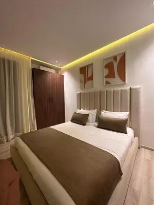 a bedroom with a large bed in a room at villa 105 golf noria piscine chauffée in Marrakech