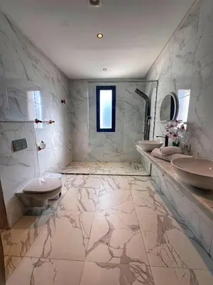 a large bathroom with a sink and a toilet at villa 105 golf noria piscine chauffée in Marrakech