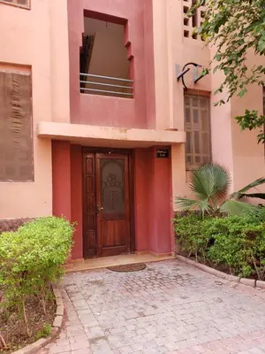 a building with a wooden door in front of it at Marrakesh 3 Bedroom Oasis in Marrakech