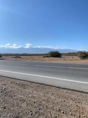 an empty road in the middle of the desert at Step into our little oasis in Marrakech