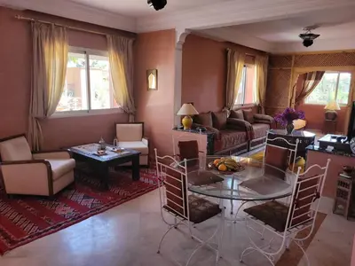 a living room with a couch and a table at MELBARI Cosy-Appart in Marrakech