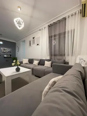 a living room with two couches and a table at Gueliz Marrakech Apartment 5 Min City Center in Marrakech