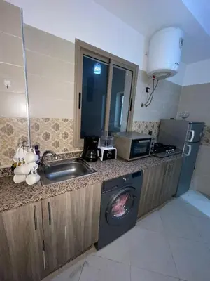 a kitchen with a sink and a washing machine at Gueliz Marrakech Apartment 5 Min City Center in Marrakech