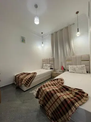 a room with two beds and two lights at Gueliz Marrakech Apartment 5 Min City Center in Marrakech