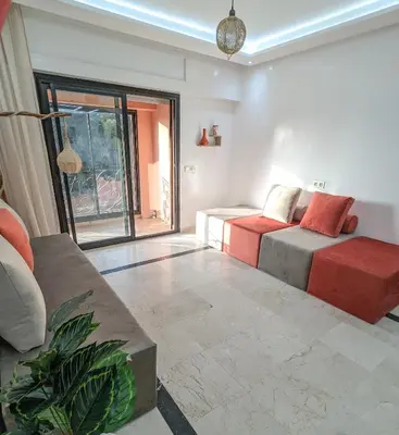 a living room with two beds and a couch at Apartement Panoramic View Majorelle Garden with Pool in Marrakech
