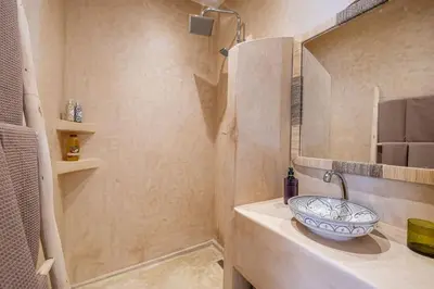 a bathroom with a sink and a shower at Riad Macan Exclusive and Trendy Chich Breakfast incl in Marrakech