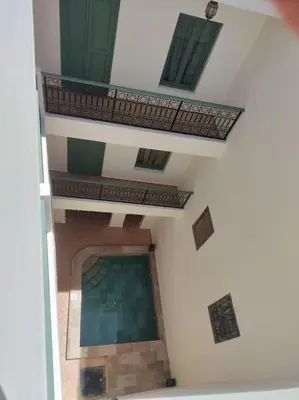 an overhead view of a swimming pool in a building at Riad White Cactus in Marrakech