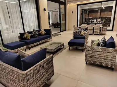 a lobby with couches and chairs in a store at Villa Moderne au sein du Golf Amelkis in Marrakech