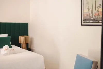a bedroom with a bed with a towel on it at Riad JW Yacout, vivez l'expérience Medina in Marrakech