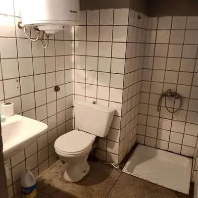 a bathroom with a white toilet and a sink at Cosy & Calm studio in Marrakech
