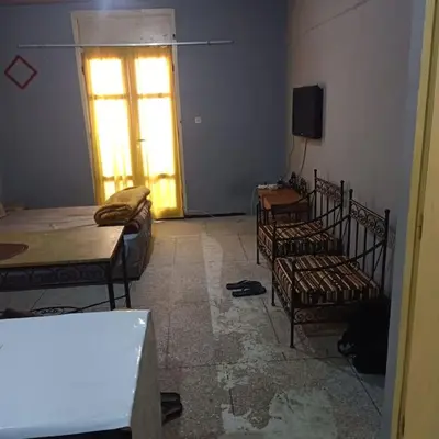 a room with three beds and a television and a window at Cosy & Calm studio in Marrakech