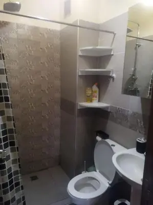a bathroom with a toilet and a sink at Le cœur de L'orient Marrakech in Marrakech