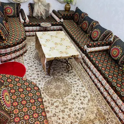 a living room with a couch and a table at Dar Al-Karma in Marrakech