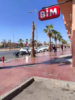 a sign for a bim gas station on a street at New DUPLEX jardins d'anas- Avenue guemassa Near Airport in Marrakech
