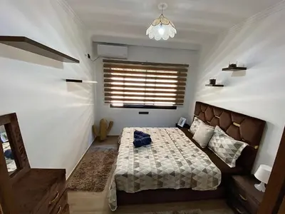a small bedroom with a bed and a window at apparte 2 chambres luxe en face la gare gueliz in Marrakech