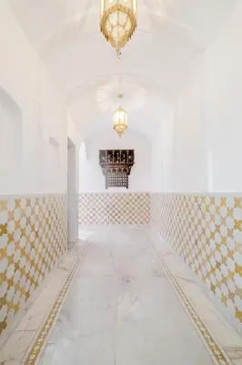 an empty room with a chandelier and a white ceiling at Free People Riad and Spa in Marrakech
