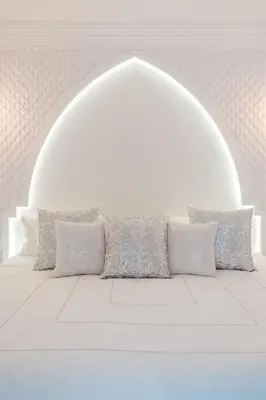 a white room with a couch with pillows on it at Free People Riad and Spa in Marrakech