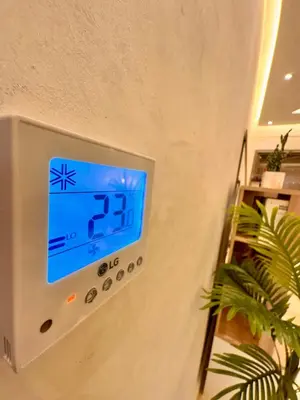 an alarm clock on the wall of a room at Pearl Garden Studio Luxueux Piscine Sunny Terrasse in Marrakech