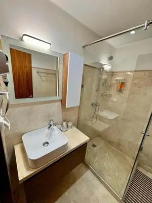 a bathroom with a sink and a shower at Pearl Garden Studio Luxueux Piscine Sunny Terrasse in Marrakech