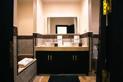 a bathroom with a sink and a mirror at Villa oasis private pool secure complex in Marrakech
