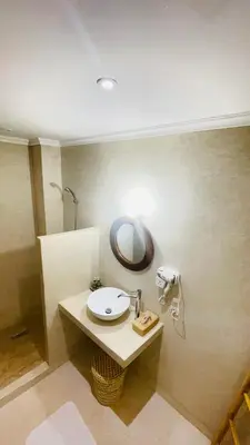 a bathroom with a sink and a mirror on the wall at Riad dei colori in Marrakech
