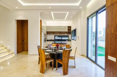 a dining room with a table and chairs at Sublime Villa A in Marrakech