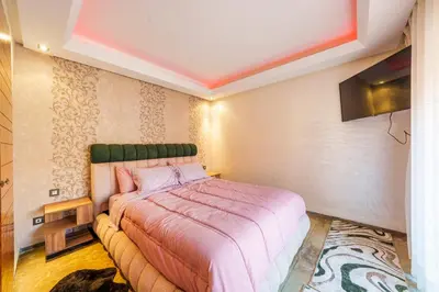 a bedroom with a bed in a room at Menara garden in Marrakech